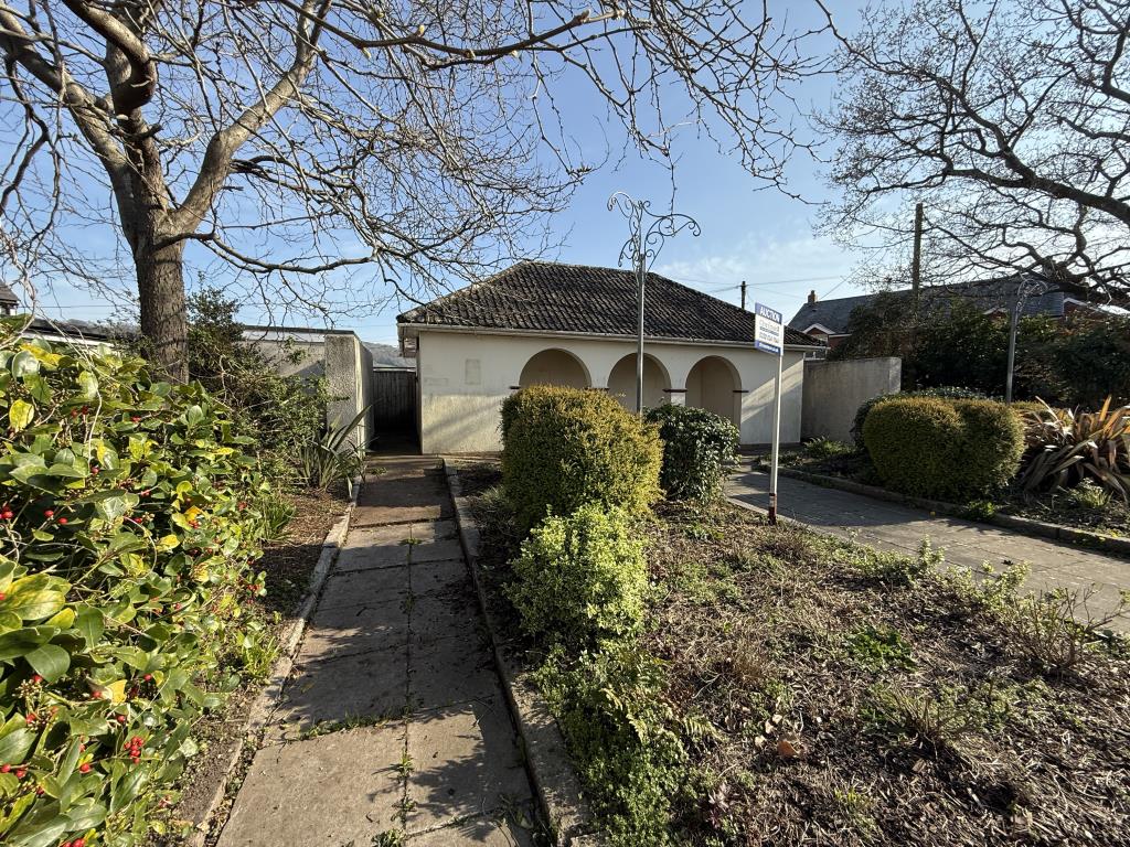 Lot: 69 - FORMER PUBLIC CONVENIENCES WITH POTENTIAL - General view of the main toilet building and detached disabled toilet